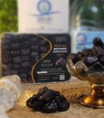 Premium Ajwa dates from Madina with zamzam water in the background
